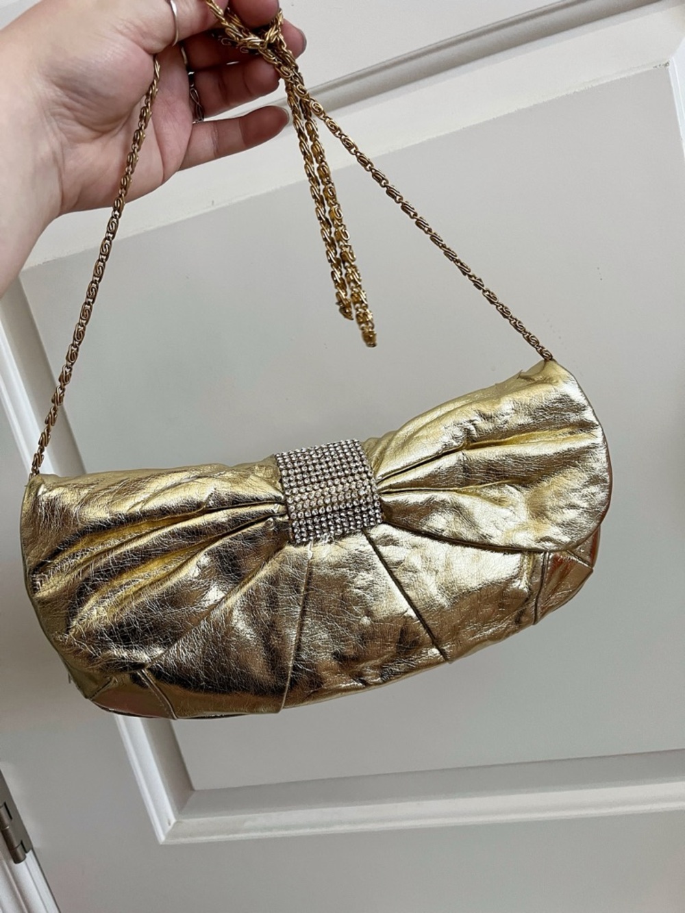 Kate Landry gold bow clutch